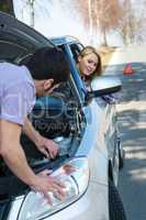 Car troubles couple starting broken vehicle