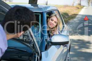 Car troubles man help woman defect vehicle