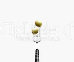 olive pierced by fork,  isolated on white background