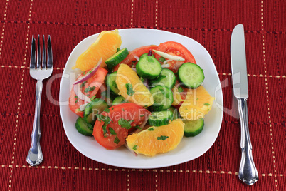 Served in dish fruits and vegetables salad.