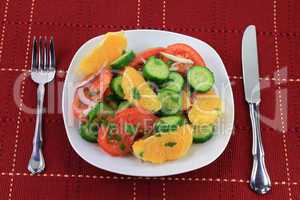Served in dish fruits and vegetables salad.