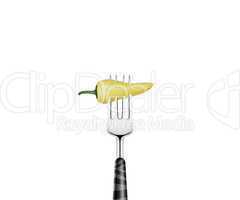 Pepper  pierced by fork,  isolated on white background