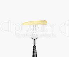 baby corn pierced by fork,  isolated on white background