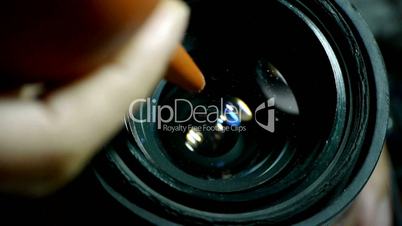 Manually clean camera lens.