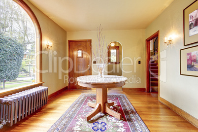 Luxury entrance home interior with round table.