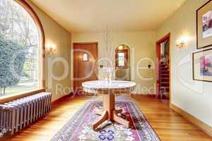 Luxury entrance home interior with round table.