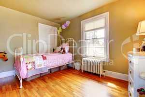Baby girl bedroom interior with pink bed.
