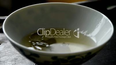 A bowl of shaking tea.china,japan,water,steaming.