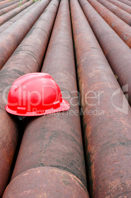 red helmet miner oil on iron pipe