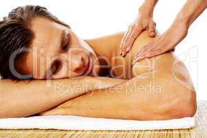 Attractive man having massage in a spa center