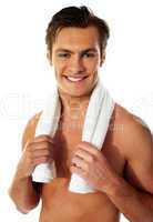 Portrait of a smiling man with towel around his neck
