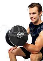 Strong young man working out with dumbbells