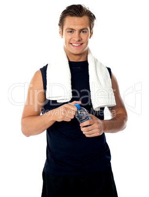 Young athlete posing with water bottle