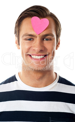 Closeup of an attractive man with paper heart