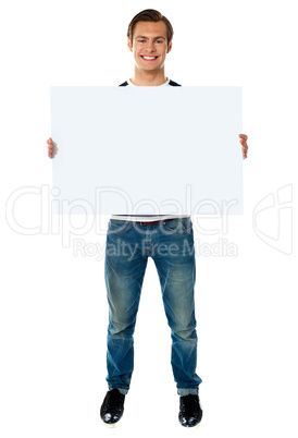 Full length view of man showing blank signboard