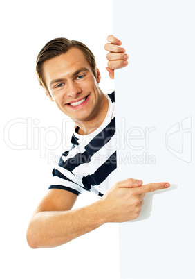 Handsome person pointing towards blank signboard