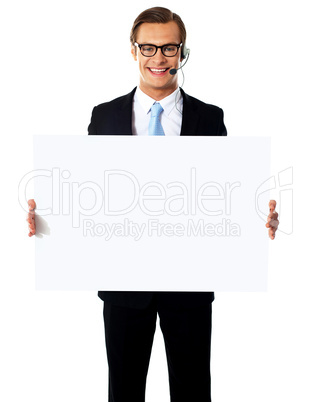 Smiling male operator with blank billboard