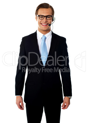 Male telemarketer posing in headsets, smiling
