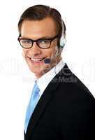 Smiling telemarketing male executive, closeup shot