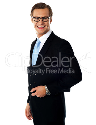 Successful young businessmale posing with documents