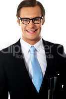 Closeup of smiling corporate young man