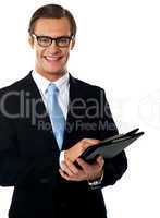 Caucasian smiling young businessman holding a folder
