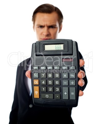 Businessman holding a calculator