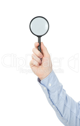 hand holding magnifying glass