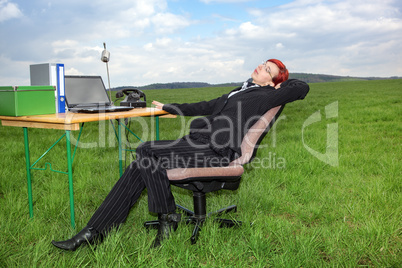 Businesswoman working in free and takes a break