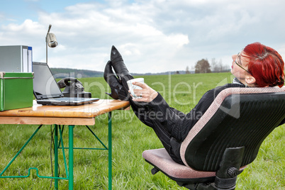 Businesswoman working in free and takes a break