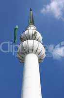 Minaret with green flag