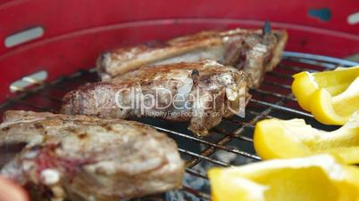Pork Steaks On Barbecue Grill