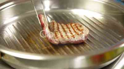 Raw Steak Grilled On Skillet
