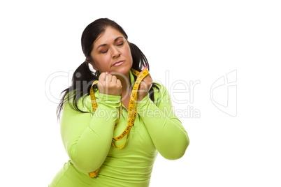 Frustrated Hispanic Woman with Tape Measure