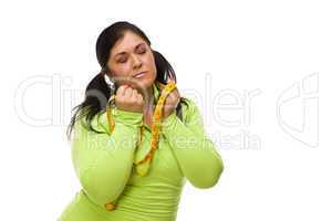 Frustrated Hispanic Woman with Tape Measure
