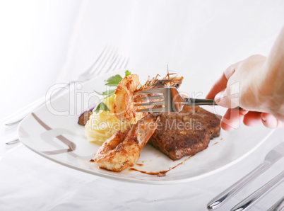 shrimp on fork over a mix food background