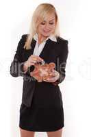 Woman holding piggy bank with a plaster