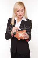 Woman holding piggy bank with a plaster