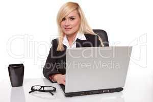 Efficient businesswoman working on her laptop