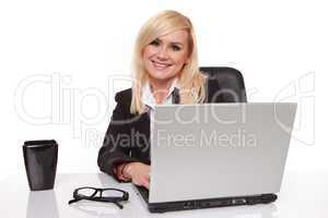 Efficient businesswoman working on her laptop