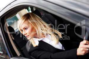 Attractive woman reversing a car