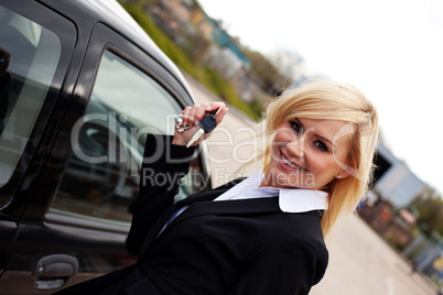 Smiling blonde with car keys