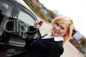 Smiling blonde with car keys