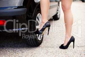 Sexy female legs in black high heels