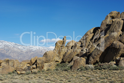 Alabama Hills rock formations and snowy mountains, California