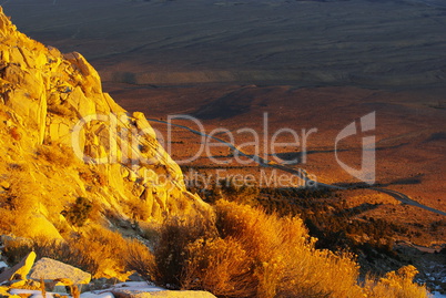 Looking down to the valley from high Sierra Nevada mountain road just after sunrise, California