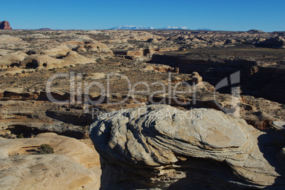 Rocks and wide view with Manti La Sal Mountains near Secret Spire, Utah