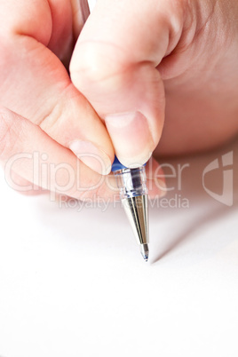 womans hand is writing a letter with a pen