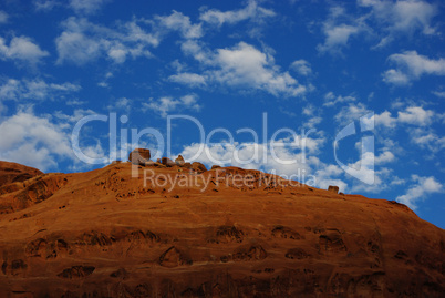 Red rock wall, blue and white sky on Burr Trail Road, Utah