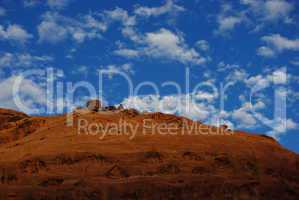 Red rock wall, blue and white sky on Burr Trail Road, Utah